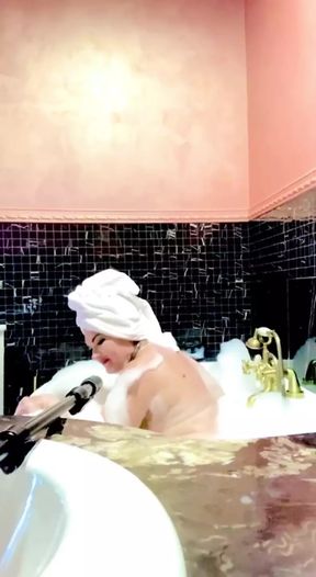 Stepmom Takes A Bath And Plays With Her Big Tits
