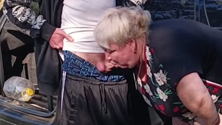 A neighbor holds my dick while I pee and then sucks it in public