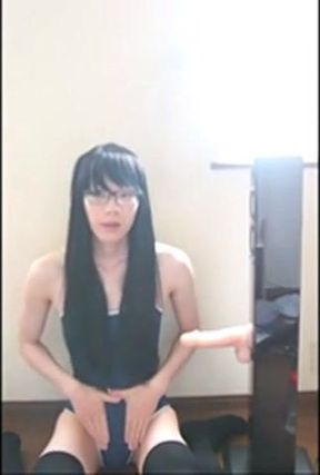 Cute Asian crossdresser cums on rubber cock