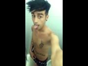 Tattooed twink is pissing in waterpark piss filled toilet