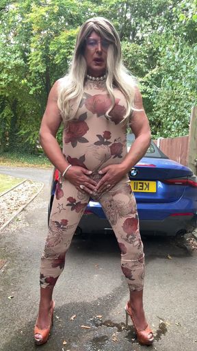Stunning moment from "Sexy Crossdresser kellycd2022 in sexy floral see thru catsuit and heels"