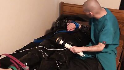 Jun 15 2022 - Rubber Boy gets smothered in leather while tied up in latex