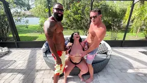 Two hot babes enjoy a poolside session with two guys packing impressive dongs.