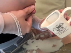 Provocative blonde maid with big hooters milks her nipples