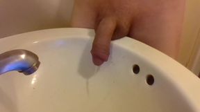 Peeing Draped Over a Sink