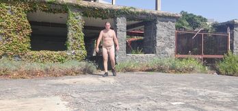 Boy completely naked near the sea