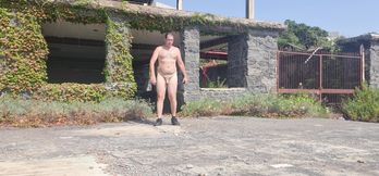 Boy completely naked near the sea