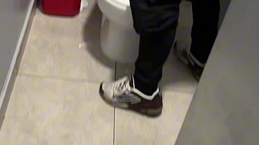boy opens cubicle and catch his friend peeing (in a club's public toilets)