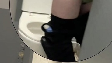 boy opens cubicle and catch his friend peeing (in a club's public toilets)