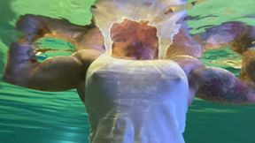 Amazon Kandy Flexes Her Massive Biceps in Her Hotel Pool