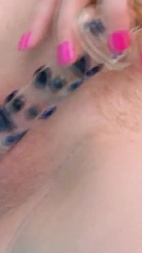 Curly-haired Babe Masturbates with Bottle in Hot Tub