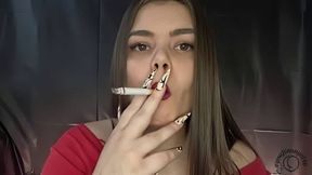 Latina smokes and holds the smoke in before exhaling