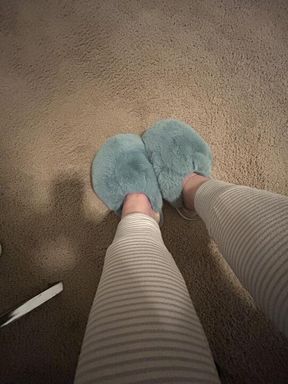 Stepmoms' Blue Fuzzy Slippers and wrinkled soles.