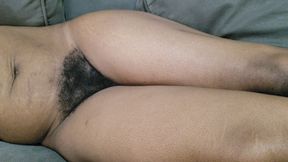 A Woman with Lots of Beautiful Pubic Hair Between Her Legs Lies on Her Sofa Waiting to Be Made Love to Her