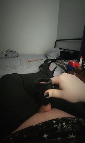 Goth trans girl in heels stroking her cock until she cums.