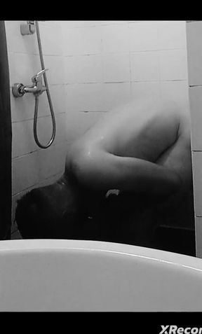 Pretty teenager takes a shower