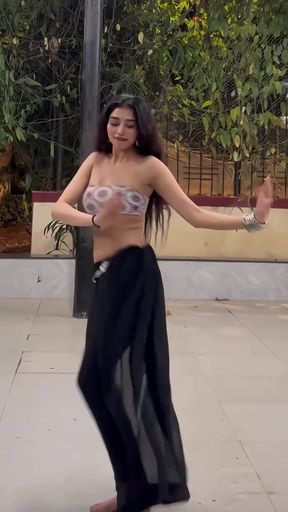 Hindi dancer in saree takes a break from her energetic routine