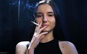 Elegant Brunette Smoking in Black Outfit