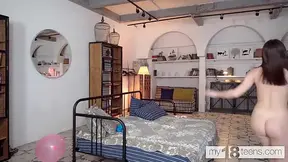 Cute blonde Jane White plays with colorful balloons