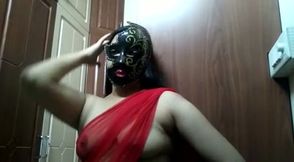Wearing a frightening mask webcam Indian girl plays with her boobs