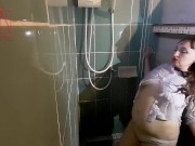 A chick in clothes under the shower. Wet panties, wet trousers, wet shirt. Full