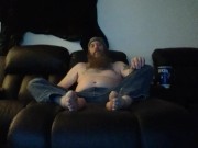 Bob hanging out barefoot in jeans