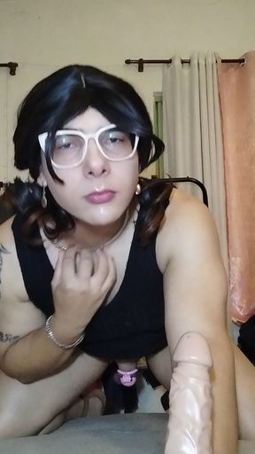 Trans with toy and cage in a chastity