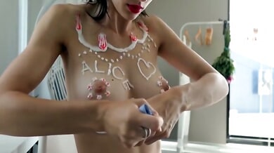 Missalice decorates her nipple with star stickers using a purple-buttoned electric tool