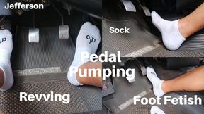 With stockings pumping car pedals (T)