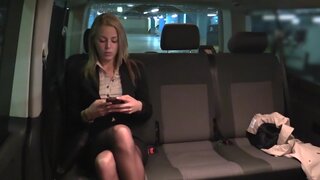 Taxi driver takes care of bored blonde girl in the backseat