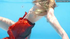 ”Petite teen Ivi Rein endures the free naked swimming”