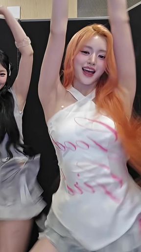 K-pop star in a white tank top dancing