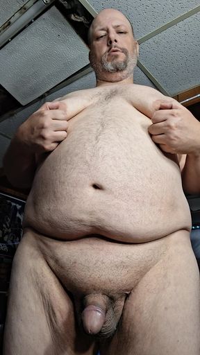 Chubby guy stands and cums