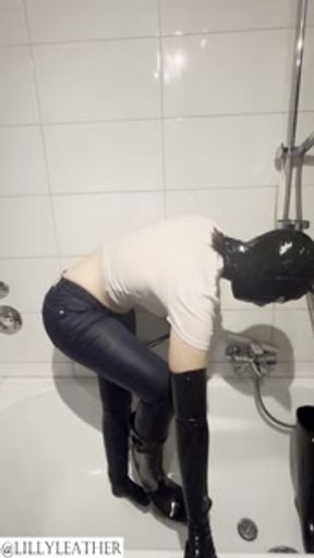 Latex teen girl pissing in jeans and rubber boots