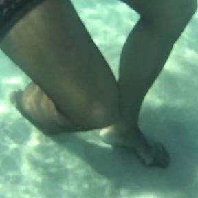 red toes and stocking in the sea