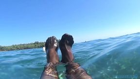 red toes and stocking in the sea