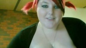 Lewd BBW with dyed hair shows her tits and meaty cunt on camera