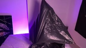 Girl in Garbage Bag Plays with Her Breath