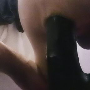 Stuffing my ass with a massive black dildo