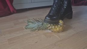 Foot crushing pineapple