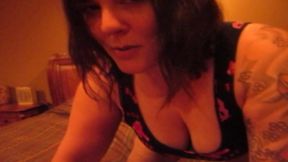 Tattooed brunette presents her big tits