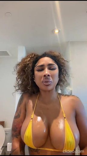 Big-titted babe shows off her ass and boobs