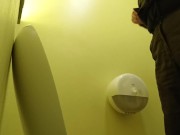 Pissing in a yellow public toilet
