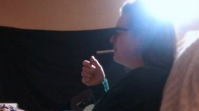 Sexy Girl With Glasses Smokes Cigarette