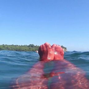 red stocking in the sea at the public beach