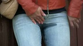 Blonde Russian girl in leather jacket and jeans pisses in public