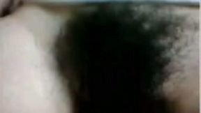 Lusty serious looking webcam black head exposed her rather hairy pussy