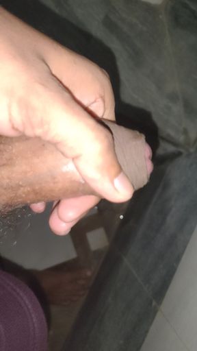 Man masturbating in bathroom