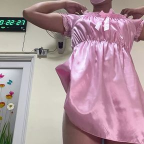 SisK dressing up pink satin nightgown