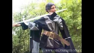 Sexy medieval knight cosplayer fucking herself with her sword hilt